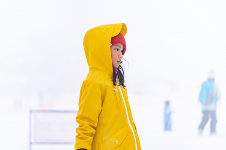 Portrait of asian kid gril in yellow winter clothing Premium Photo