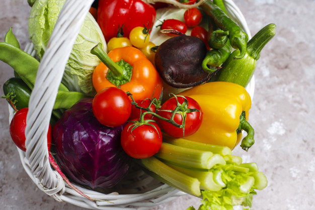 Different colorful fresh vegetables on concrete surface Free Photo