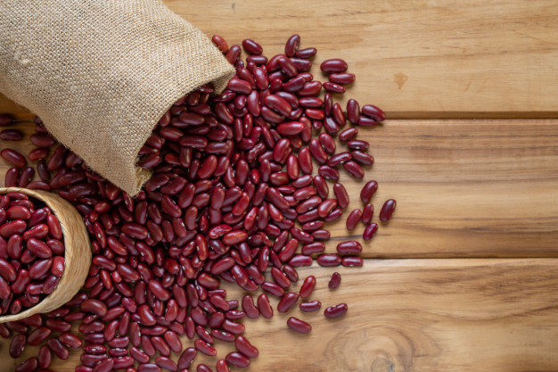 Red bean paste on brown wood floor. Free Photo