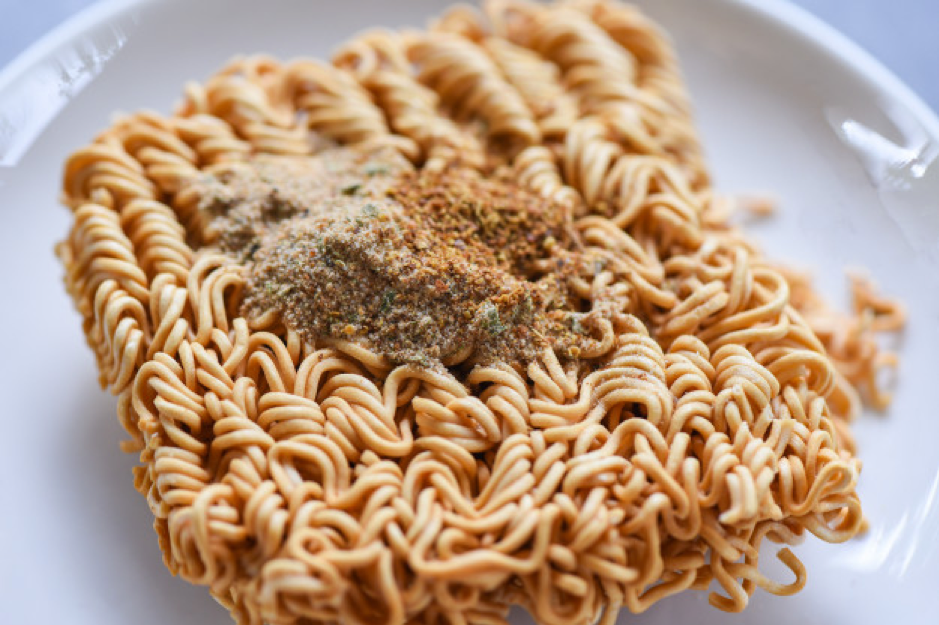 Instant noodles on bowl with seasonings monosodium glutamate junk food or fast food diet unhealthy eating Premium Photo